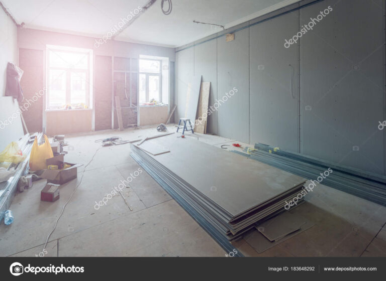 Working process of installing metal frames for plasterboard (drywall) for making gypsum walls in apartment is under construction, remodeling, renovation, extension, restoration and reconstruction.